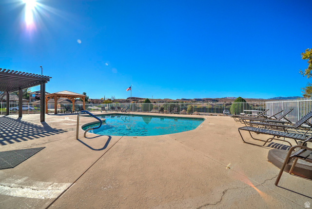 2212 Chippenham Court St. George, UT 84770 - Photo 37 of 75 Community pool featuring a patio and a pergola