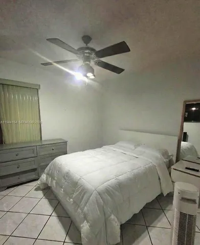 a bedroom with a bed and a table