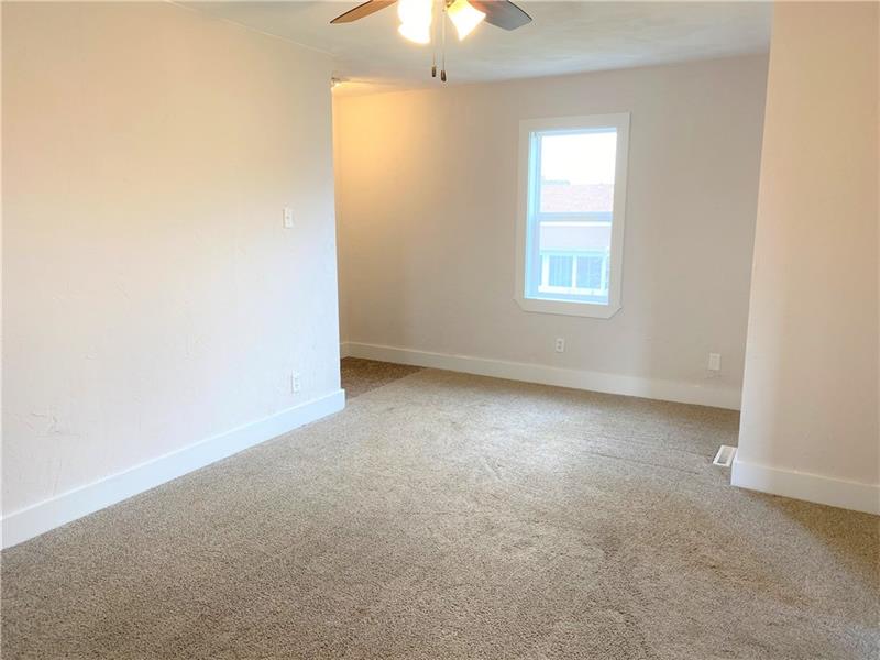 107 Reed Avenue Rostraver Township, PA 15012 - Photo 14 of 19 Large bonus room which could be used for multiple purposes.