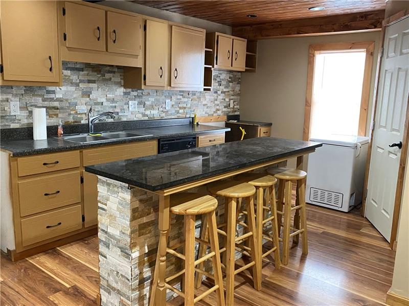 107 Reed Avenue Rostraver Township, PA 15012 - Photo 5 of 19 Cultured stone island with quartz coutnertop.