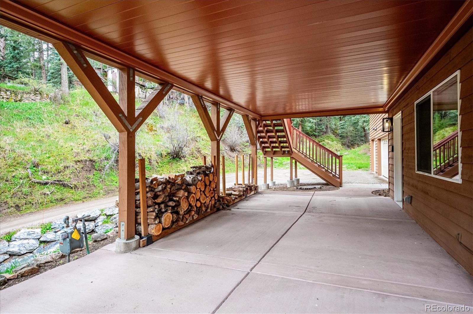 6747 South Brook Forest Road Evergreen, CO 80439 - Photo 37 of 49 a view of porch with green space