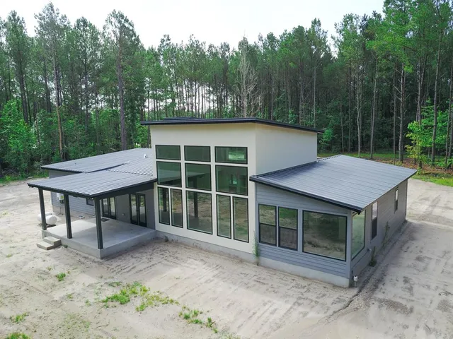 a view of a park with large trees