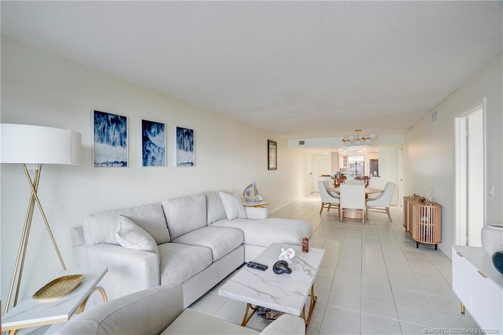 10 Northeast Plantation Road, Unit 101 Jensen Beach, FL 34957 - Photo 38 of 53 a living room with furniture and a couch