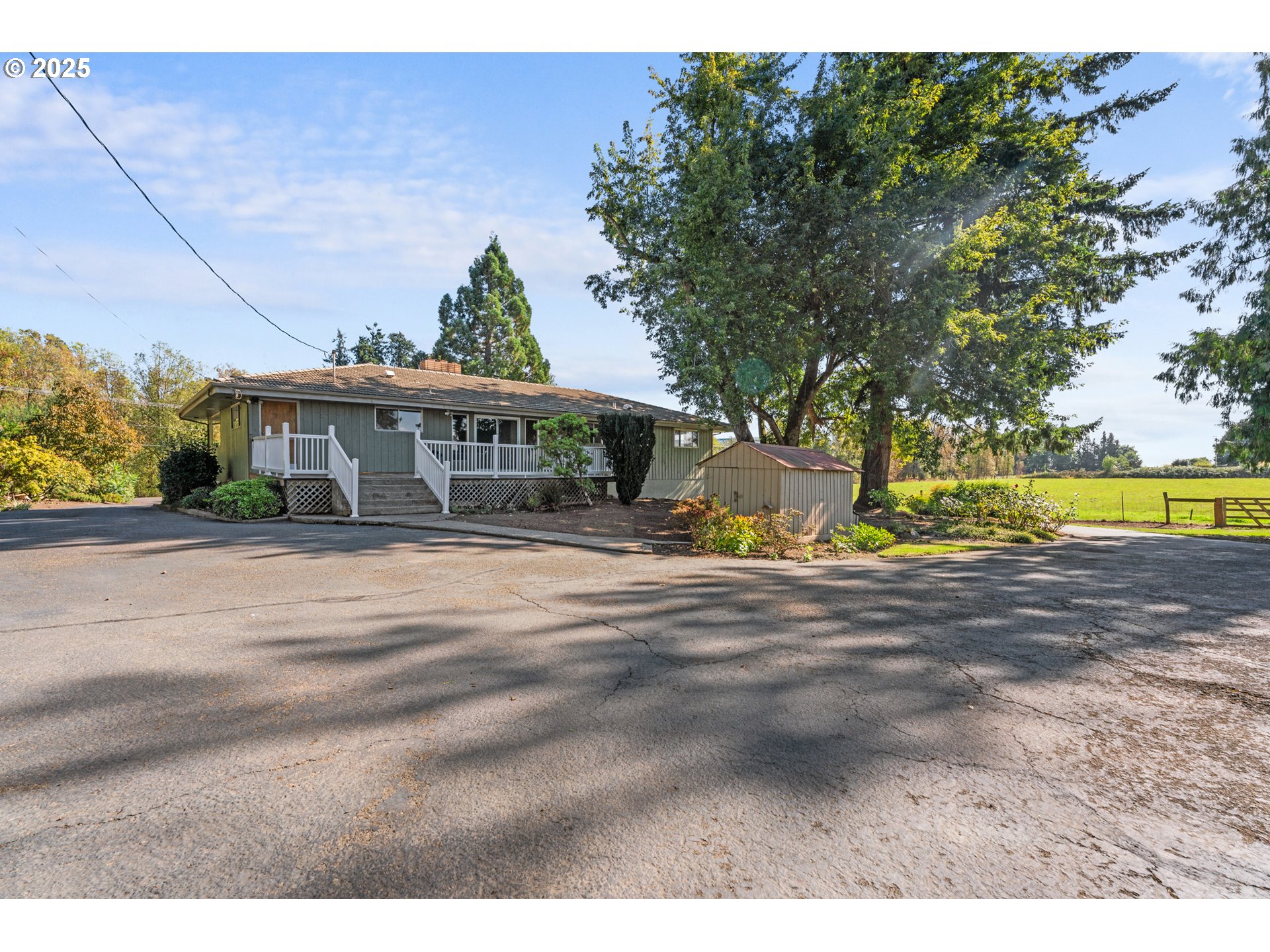 15895 Old Butteville Road Northeast Woodburn, OR 97071 - Photo 26 of 47 a view of swimming pool with a yard and plants