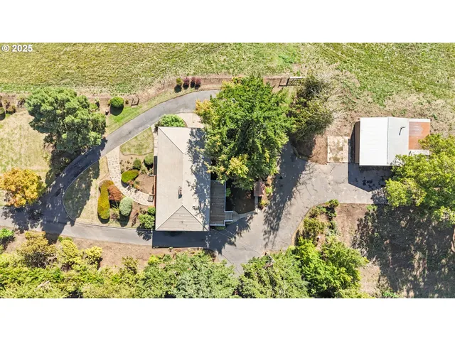 a view of house with a yard