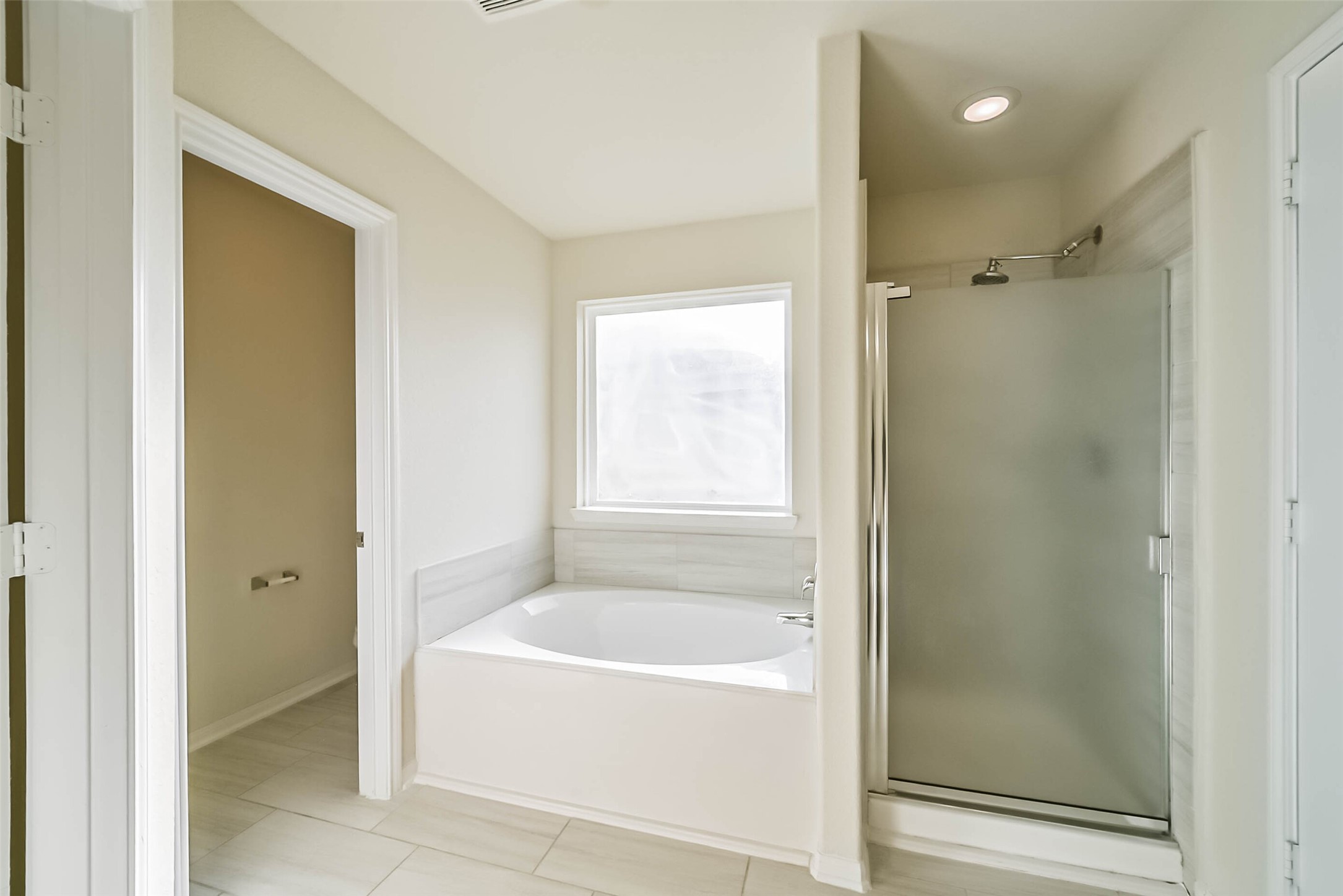 2630 Zephyr Lane Rosenberg, TX 77471 - Photo 21 of 33 a bathroom with a bathtub and a shower