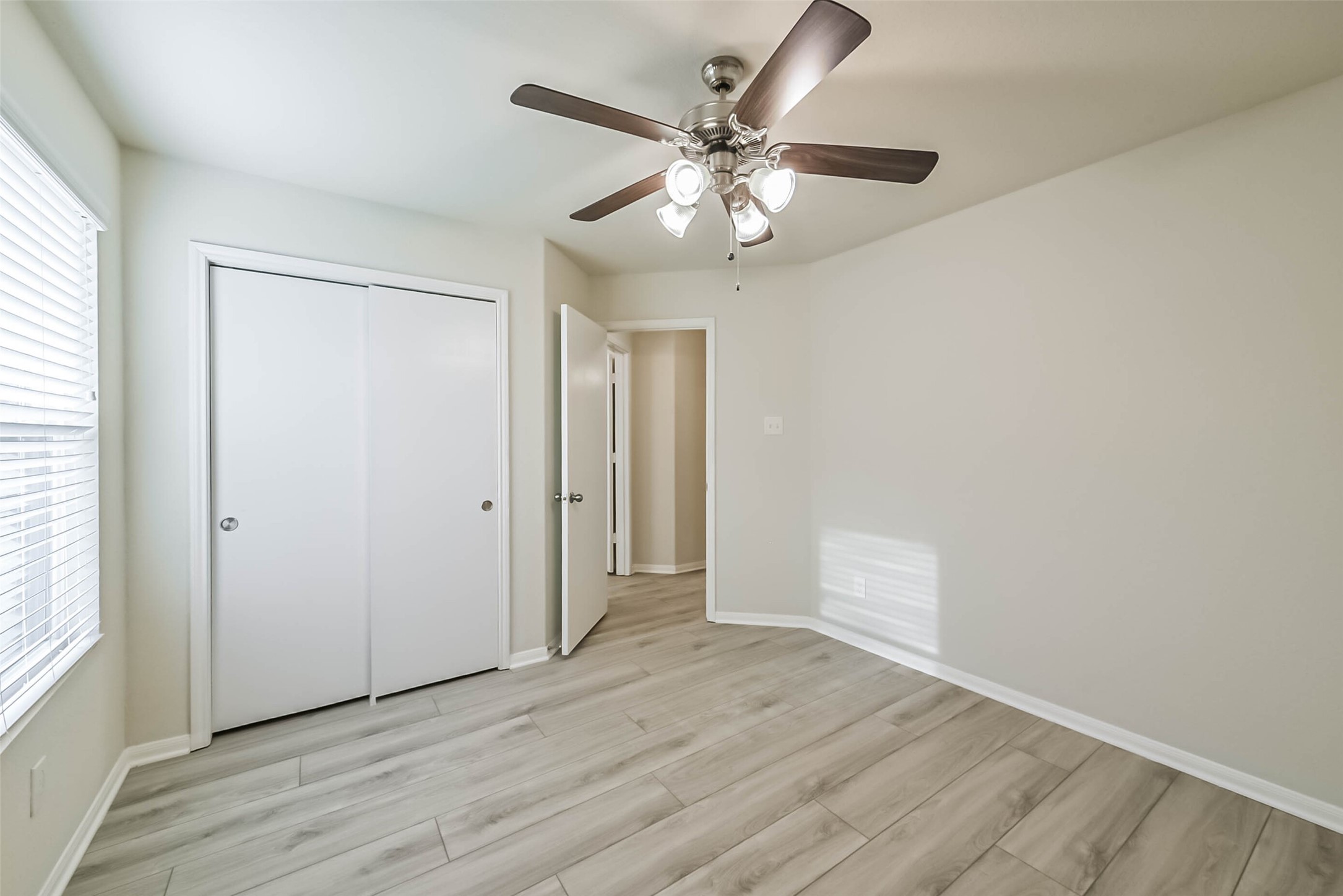 2630 Zephyr Lane Rosenberg, TX 77471 - Photo 30 of 33 wooden floor in an empty room with a window