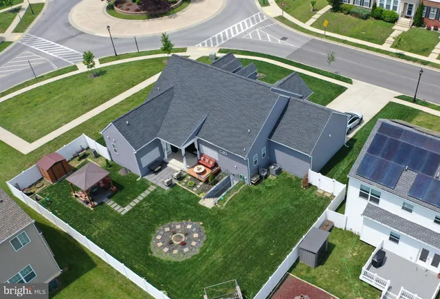 an aerial view of a house with a garden and trees