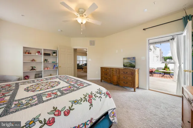 a spacious bathroom with a double vanity sink a large mirror and shower