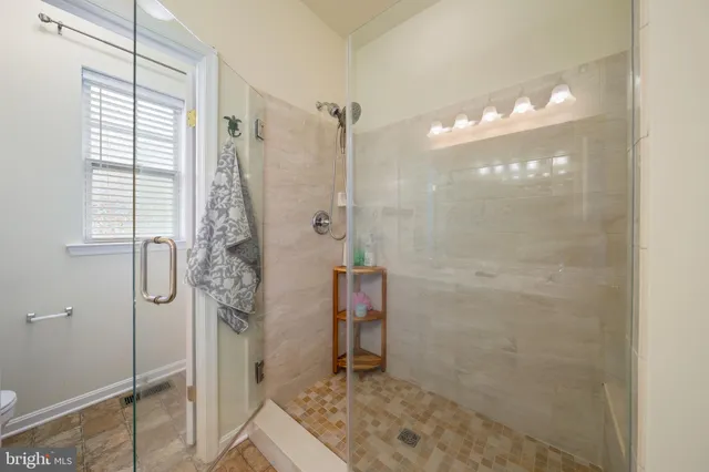 a bedroom with bed and couch