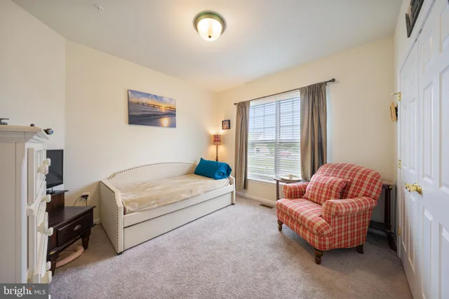 a bathroom with a sink a toilet a shower and a mirror