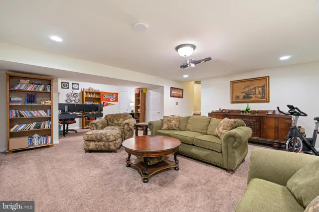 a view of a patio with couches table and chairs and potted plants