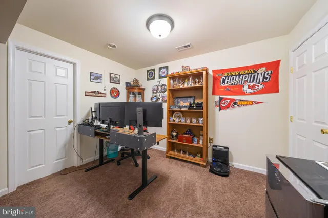 a balcony with furniture and a ceiling fan