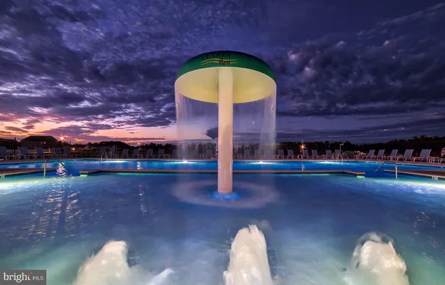 a front view of a house with a yard table and chairs