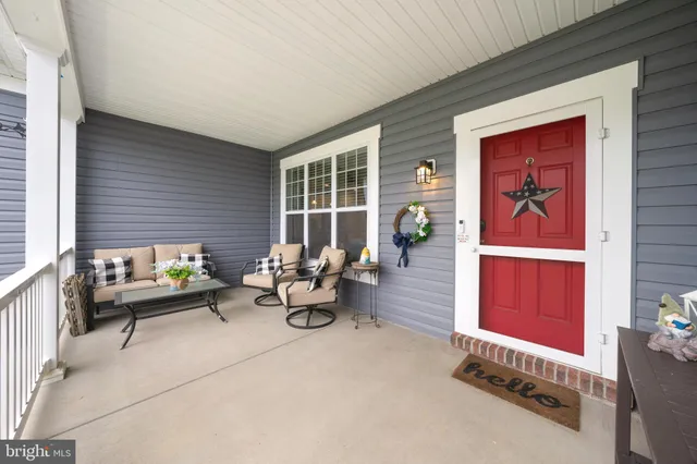 a large kitchen with kitchen island granite countertop a sink a counter top space and cabinets