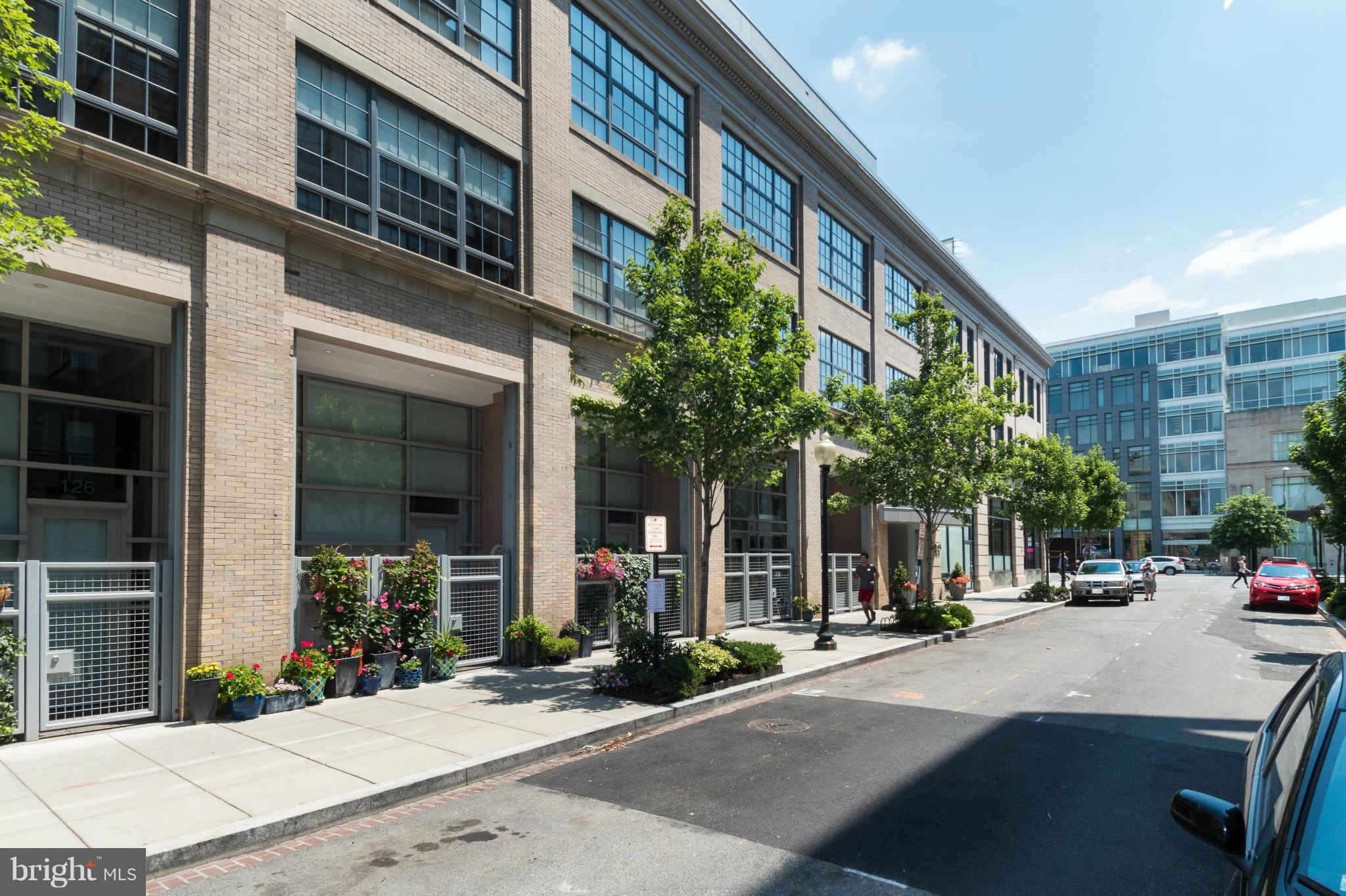 1401 Church Street Northwest, Unit 306 Washington, DC 20005 - Photo 1 of 18 a view of a brick building with a large windows
