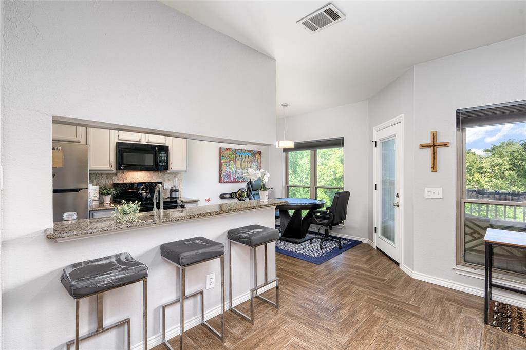 7340 Skillman Street, Unit 1113 Dallas, TX 75231 - Photo 11 of 31 Granite C-Tops & Breakfast Bar Updated SS Appliances & White Cabinetry!