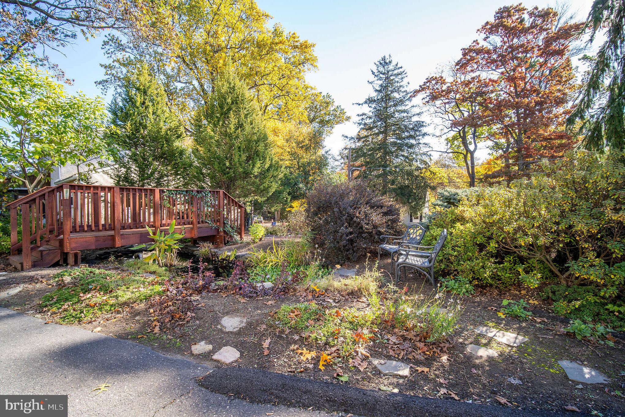 313 Edgewood Drive, Unit E Ambler, PA 19002 - Photo 4 of 9 a backyard of a house with yard and outdoor seating