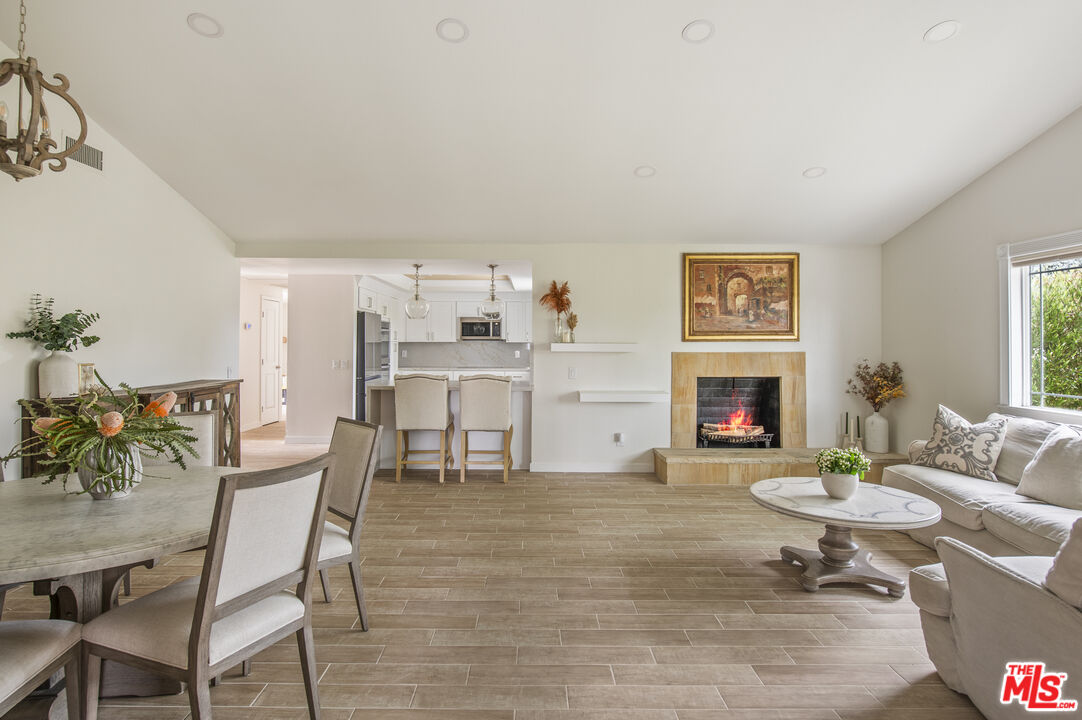 29720 Monte Verde Road Temecula, CA 92591 - Photo 12 of 49 a living room with furniture a fireplace and a table