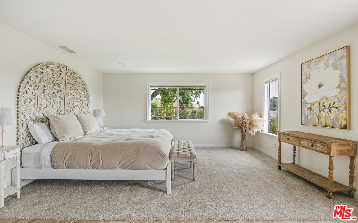 29720 Monte Verde Road Temecula, CA 92591 - Photo 16 of 49 a bedroom with a large bed and a window