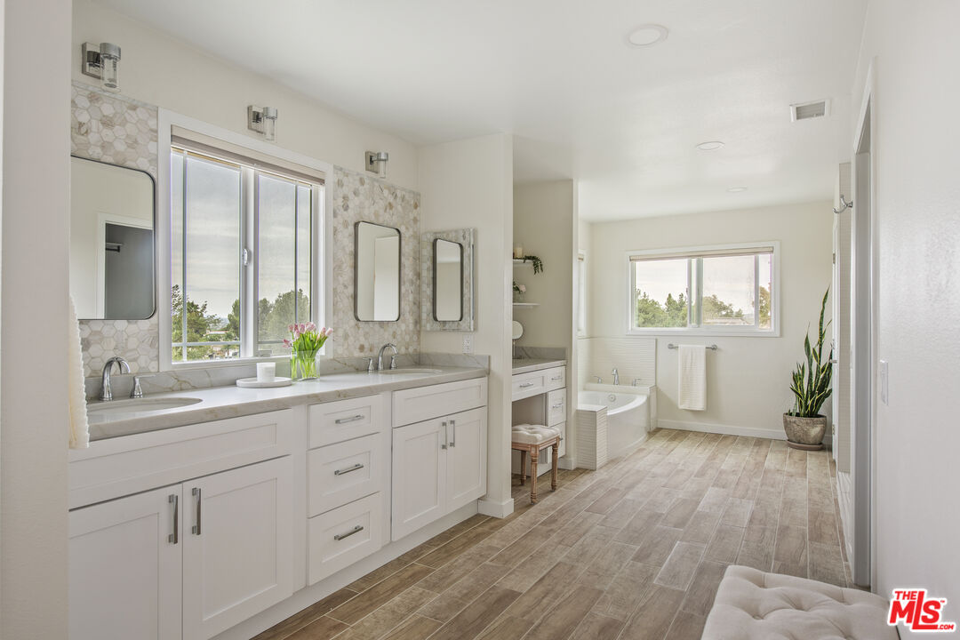 29720 Monte Verde Road Temecula, CA 92591 - Photo 19 of 49 a spacious bathroom with a double vanity sink and a mirror