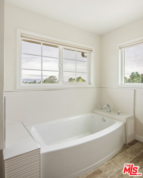 29720 Monte Verde Road Temecula, CA 92591 - Photo 22 of 49 a white bath tub sitting next to a window