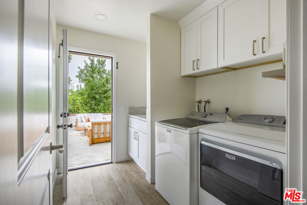 29720 Monte Verde Road Temecula, CA 92591 - Photo 39 of 49 a kitchen with a stove a sink and a refrigerator