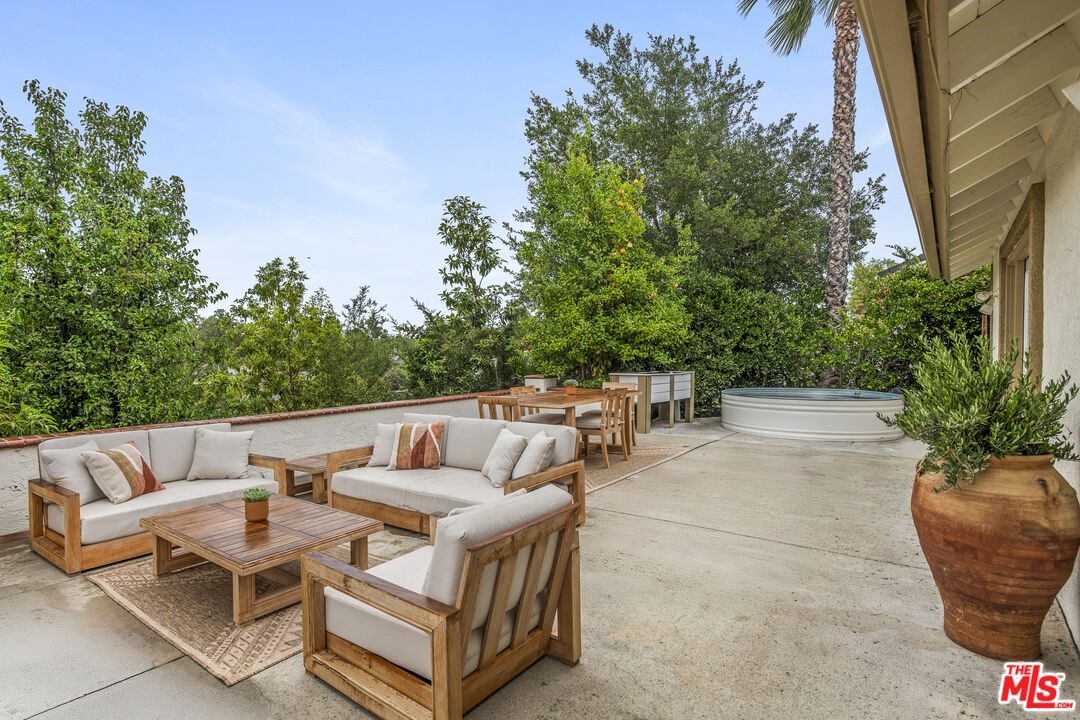 29720 Monte Verde Road Temecula, CA 92591 - Photo 40 of 49 a view of backyard with a table and chairs