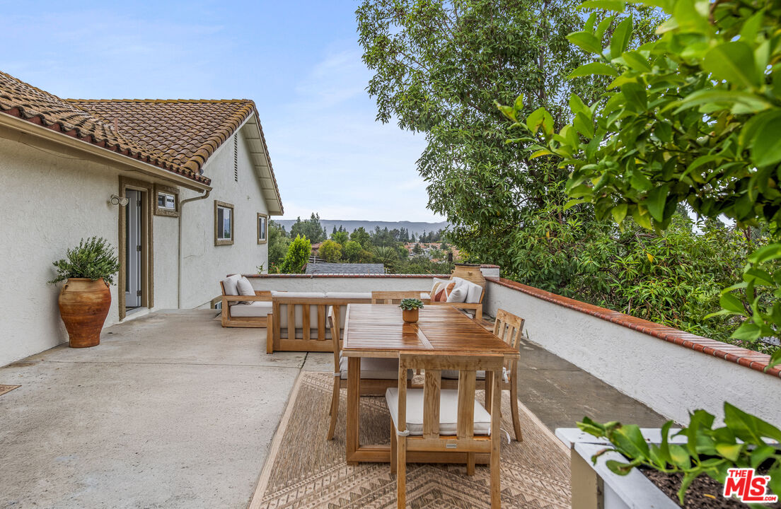 29720 Monte Verde Road Temecula, CA 92591 - Photo 42 of 49 a view of balcony with furniture and a potted plant
