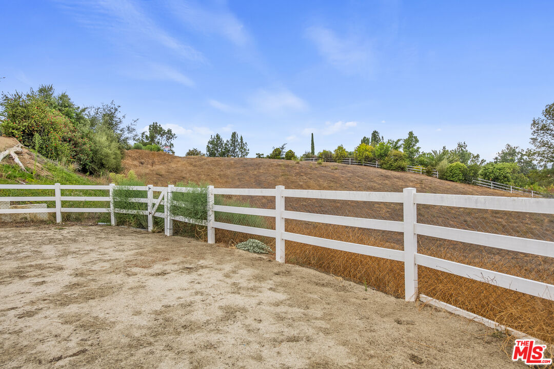29720 Monte Verde Road Temecula, CA 92591 - Photo 48 of 49 a view of a yard with wooden fence