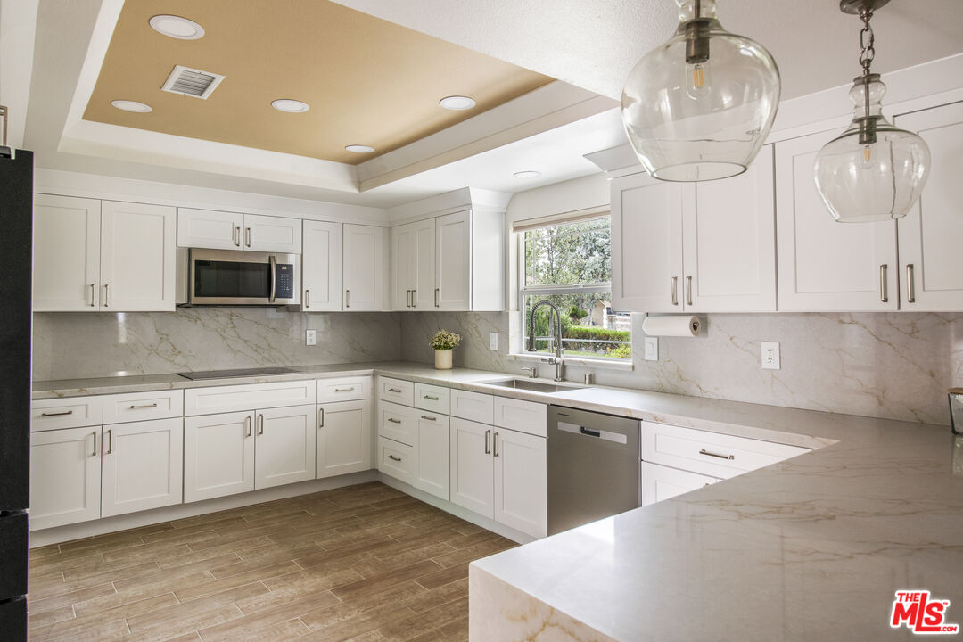29720 Monte Verde Road Temecula, CA 92591 - Photo 7 of 49 a kitchen with sink cabinets and microwave