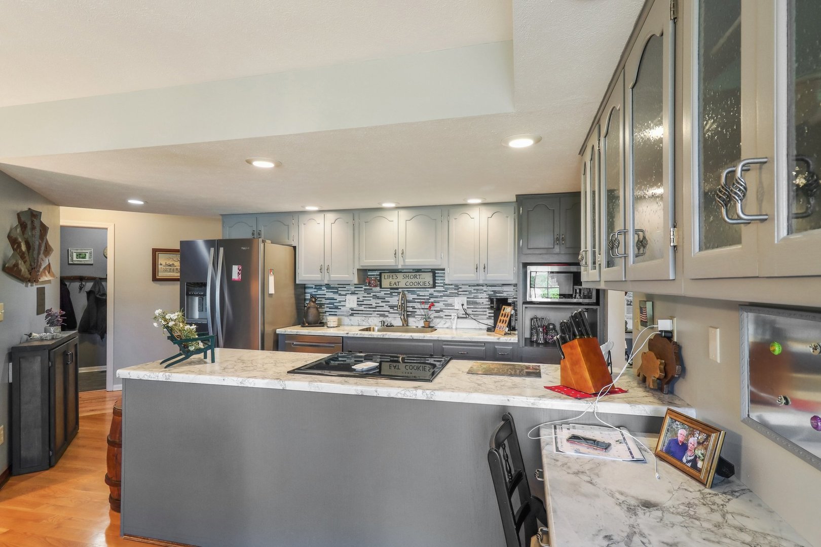 554 Baintree Road Davis, IL 61019 - Photo 15 of 53 a view of a kitchen with kitchen island stainless steel appliances refrigerator stove microwave and sink