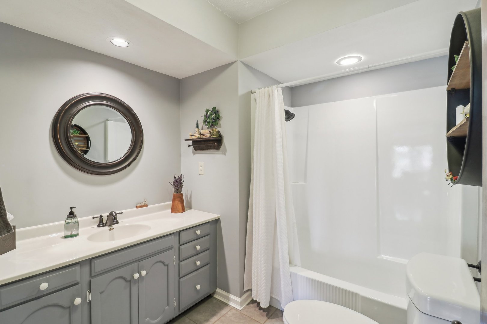 554 Baintree Road Davis, IL 61019 - Photo 27 of 53 a bathroom with a double vanity sink and a mirror