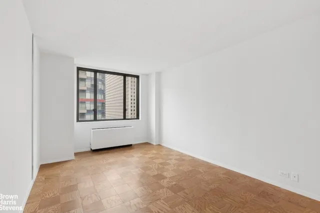 a view of an empty room with a window