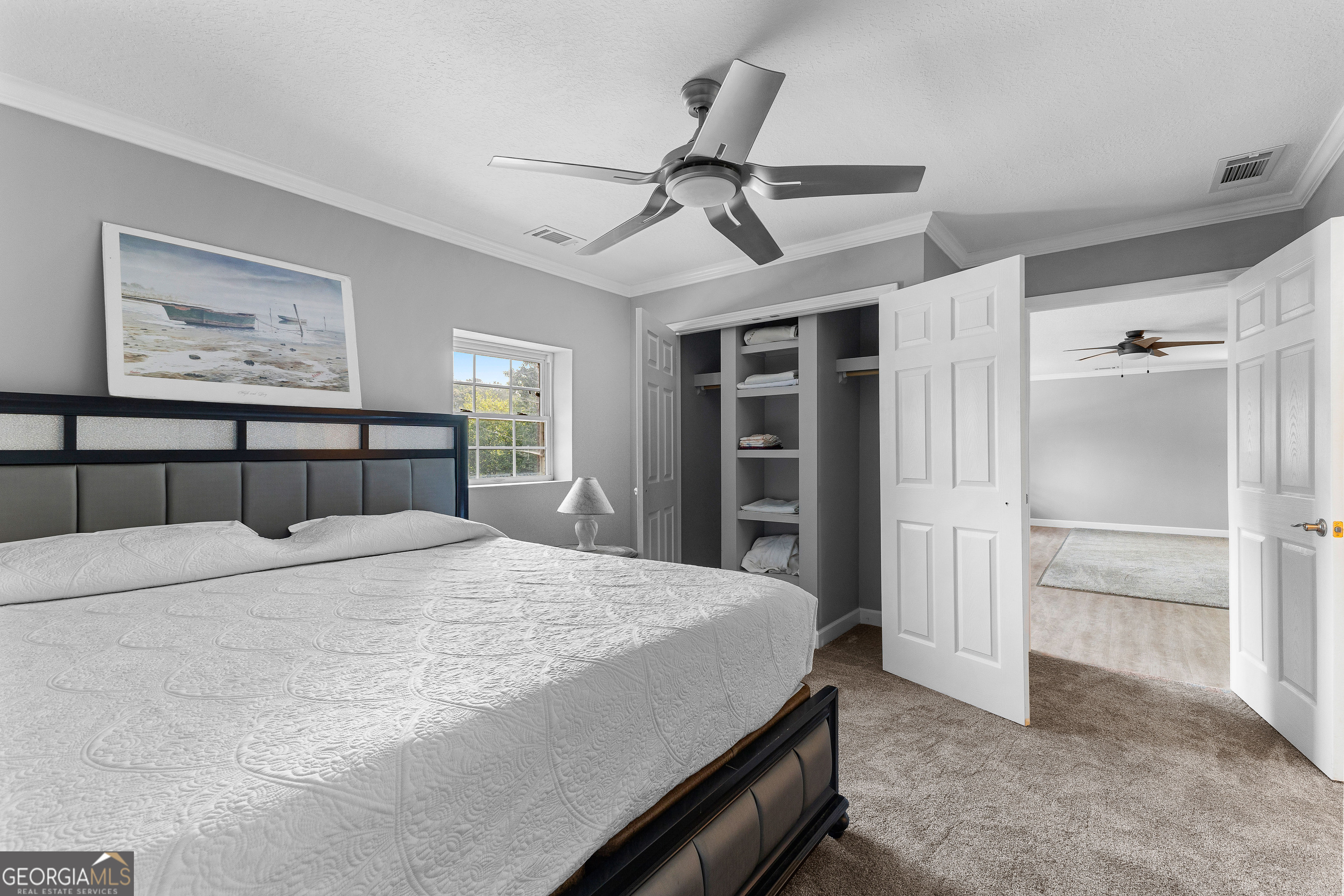 6536 Luthersville Road Gay, GA 30218 - Photo 54 of 93 a bedroom with a large bed and a chandelier