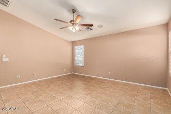 10344 West Trumbull Road Tolleson, AZ 85353 - Photo 16 of 22 an empty room with a window and a fan