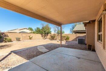 10344 West Trumbull Road Tolleson, AZ 85353 - Photo 19 of 22 a view of a house with a yard