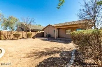 a view of a house with snow on the road