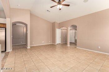 10344 West Trumbull Road Tolleson, AZ 85353 - Photo 5 of 22 an empty room with fan and entrance