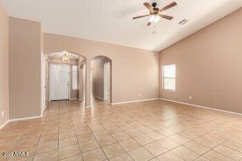 10344 West Trumbull Road Tolleson, AZ 85353 - Photo 6 of 22 a view of a livingroom with a ceiling fan and window