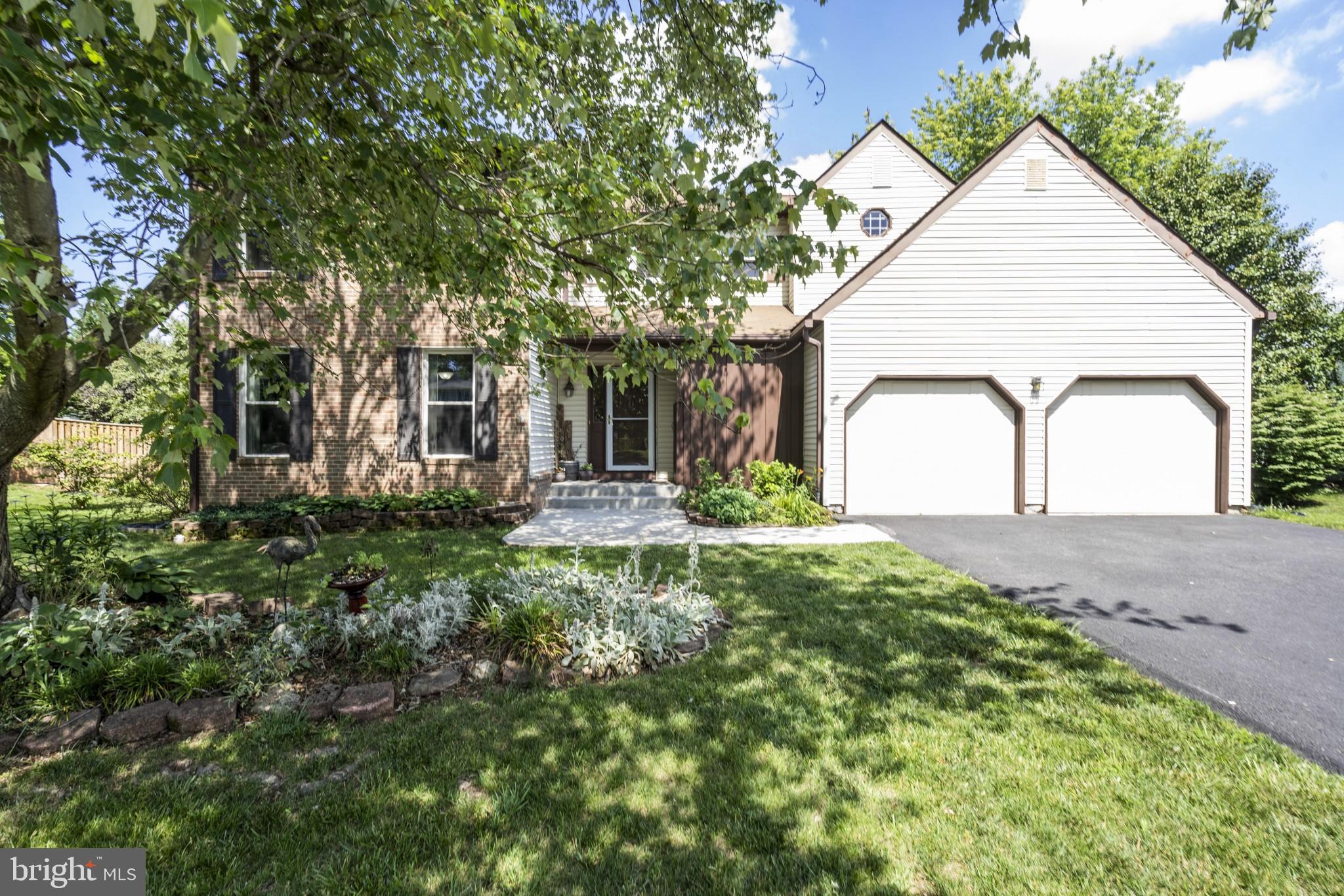 1309 Rock Chapel Road Herndon, VA 20170 - Photo 1 of 3 a view of a white house with a small yard and plants