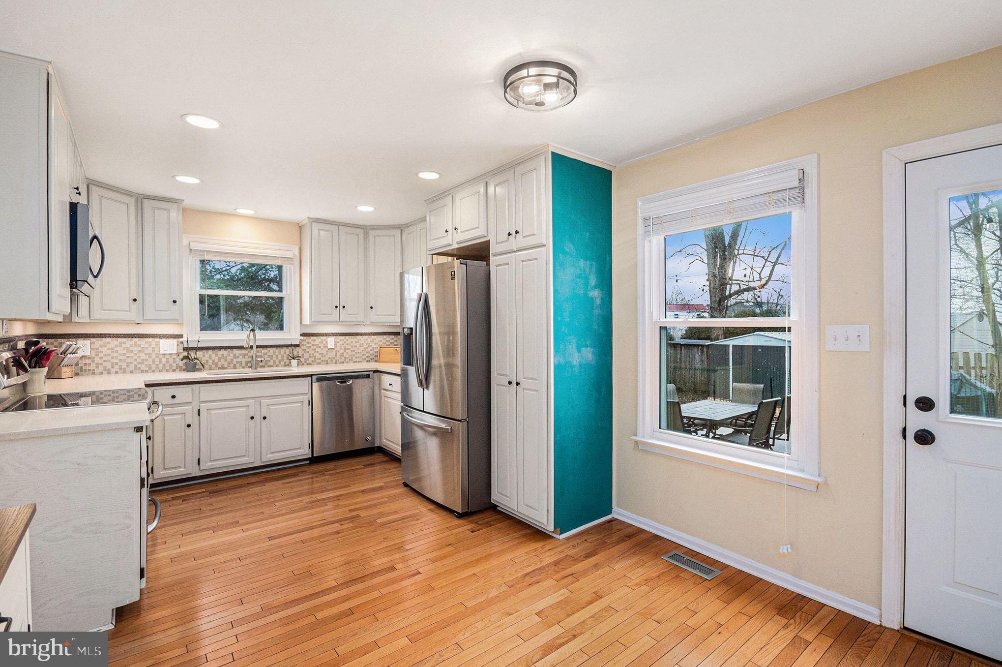 1309 Rock Chapel Road Herndon, VA 20170 - Photo 12 of 41 a kitchen with a refrigerator and a sink