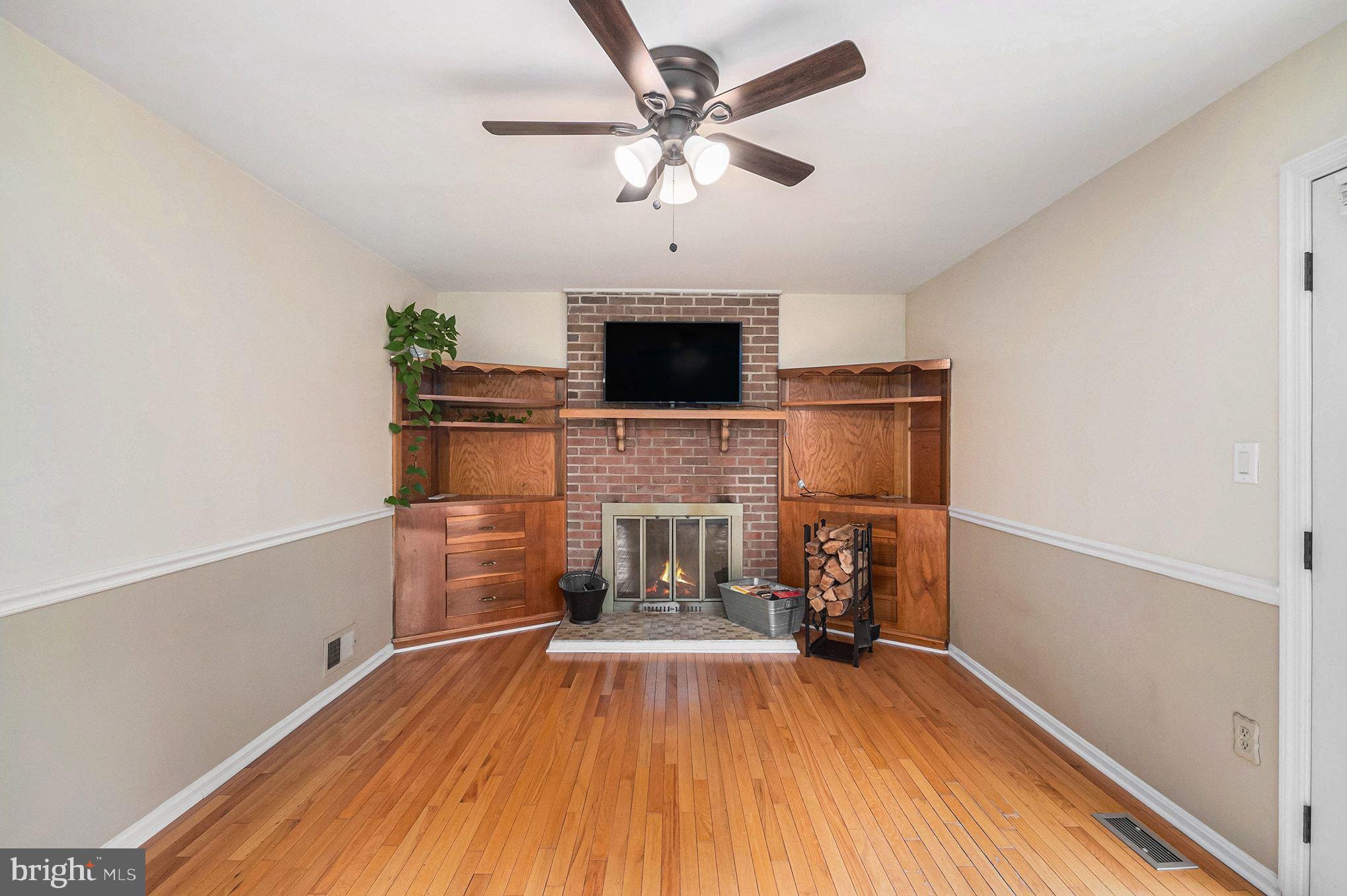 1309 Rock Chapel Road Herndon, VA 20170 - Photo 14 of 41 a living room with furniture and a fireplace