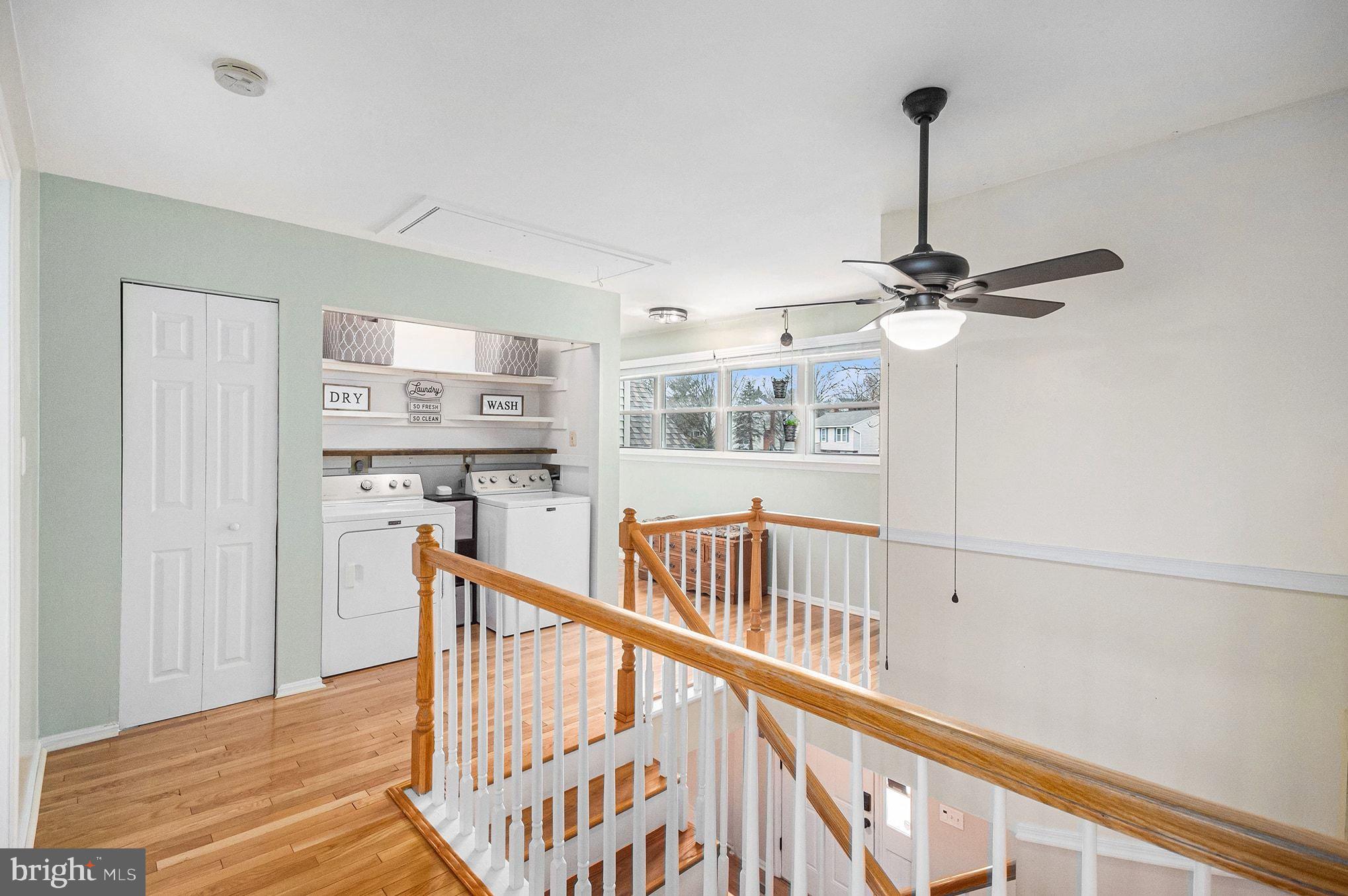 1309 Rock Chapel Road Herndon, VA 20170 - Photo 18 of 41 a view of a hallway with wooden floor and staircase