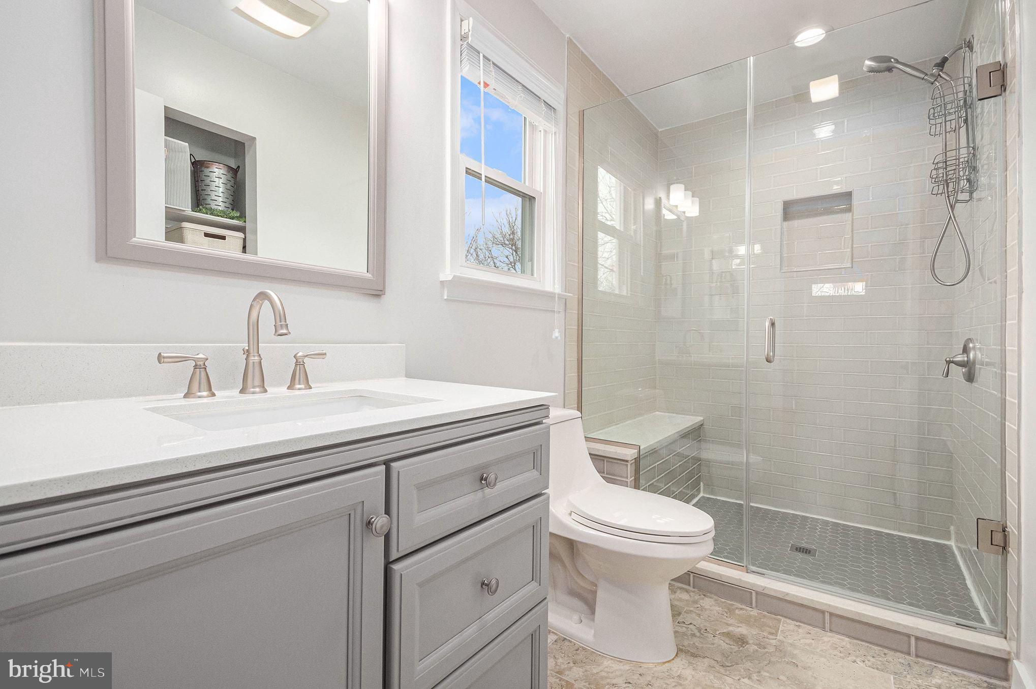 1309 Rock Chapel Road Herndon, VA 20170 - Photo 21 of 41 a bathroom with a toilet sink a shower and a mirror