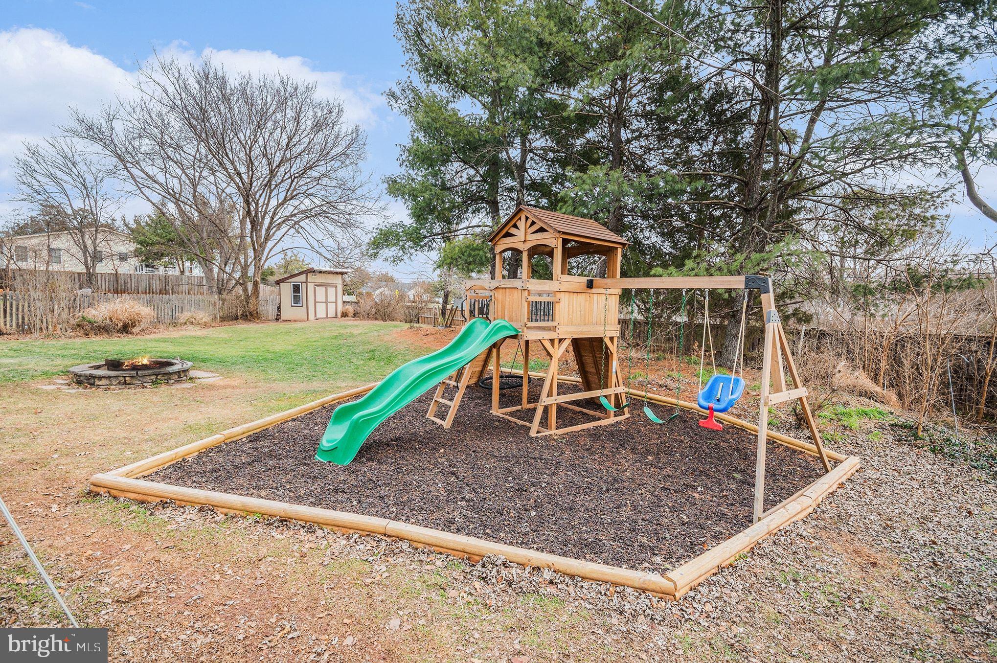 1309 Rock Chapel Road Herndon, VA 20170 - Photo 33 of 41 a view of a house with a yard