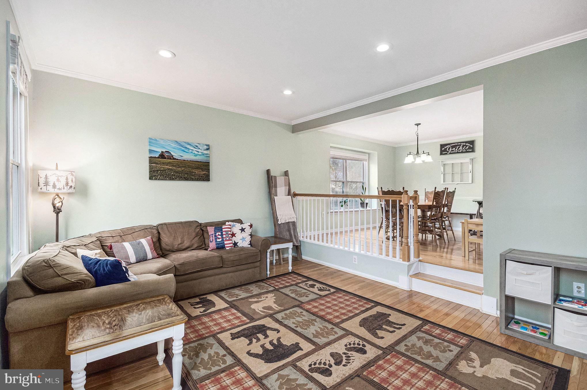 1309 Rock Chapel Road Herndon, VA 20170 - Photo 5 of 41 a living room with furniture and a rug
