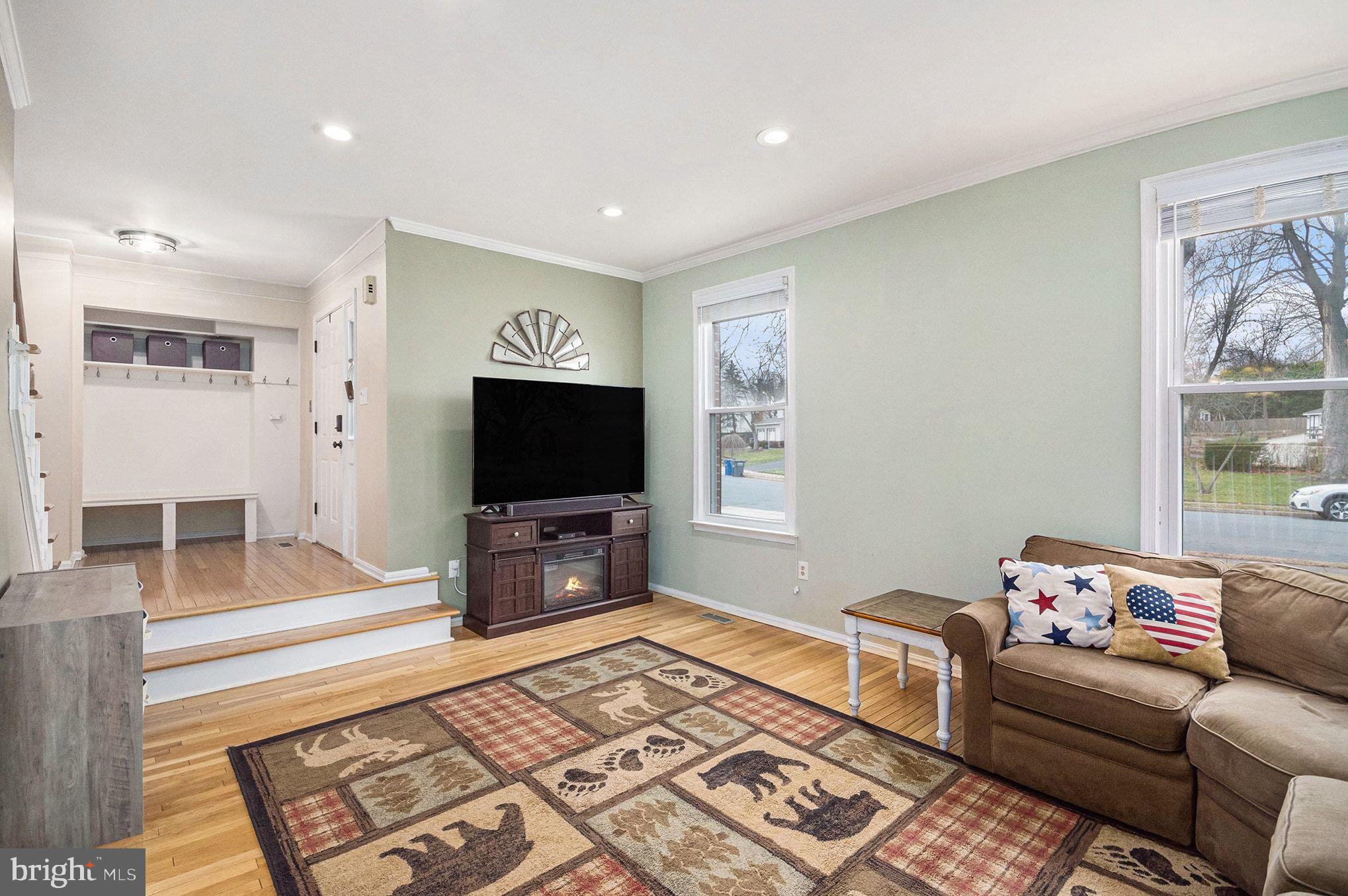 1309 Rock Chapel Road Herndon, VA 20170 - Photo 6 of 41 a living room with furniture and a flat screen tv