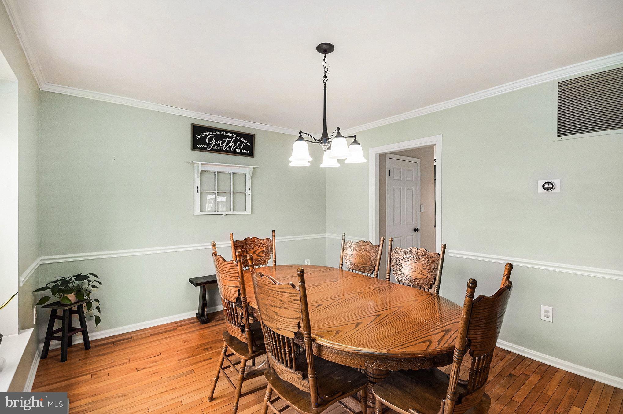1309 Rock Chapel Road Herndon, VA 20170 - Photo 7 of 41 a view of a dining room with furniture and wooden floor
