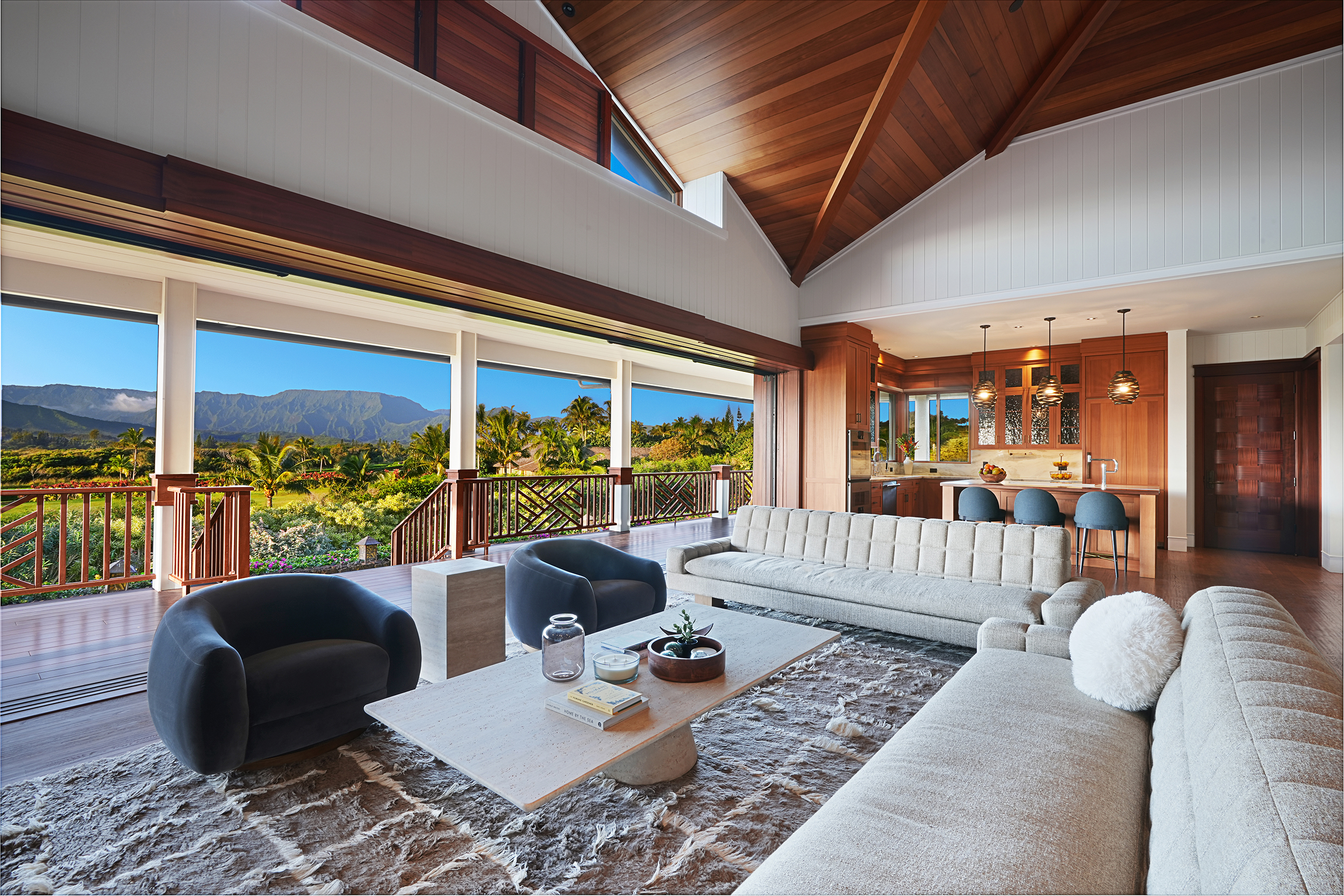 a living room with furniture and a floor to ceiling window